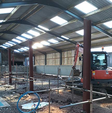 JR Hind building a dairy parlour